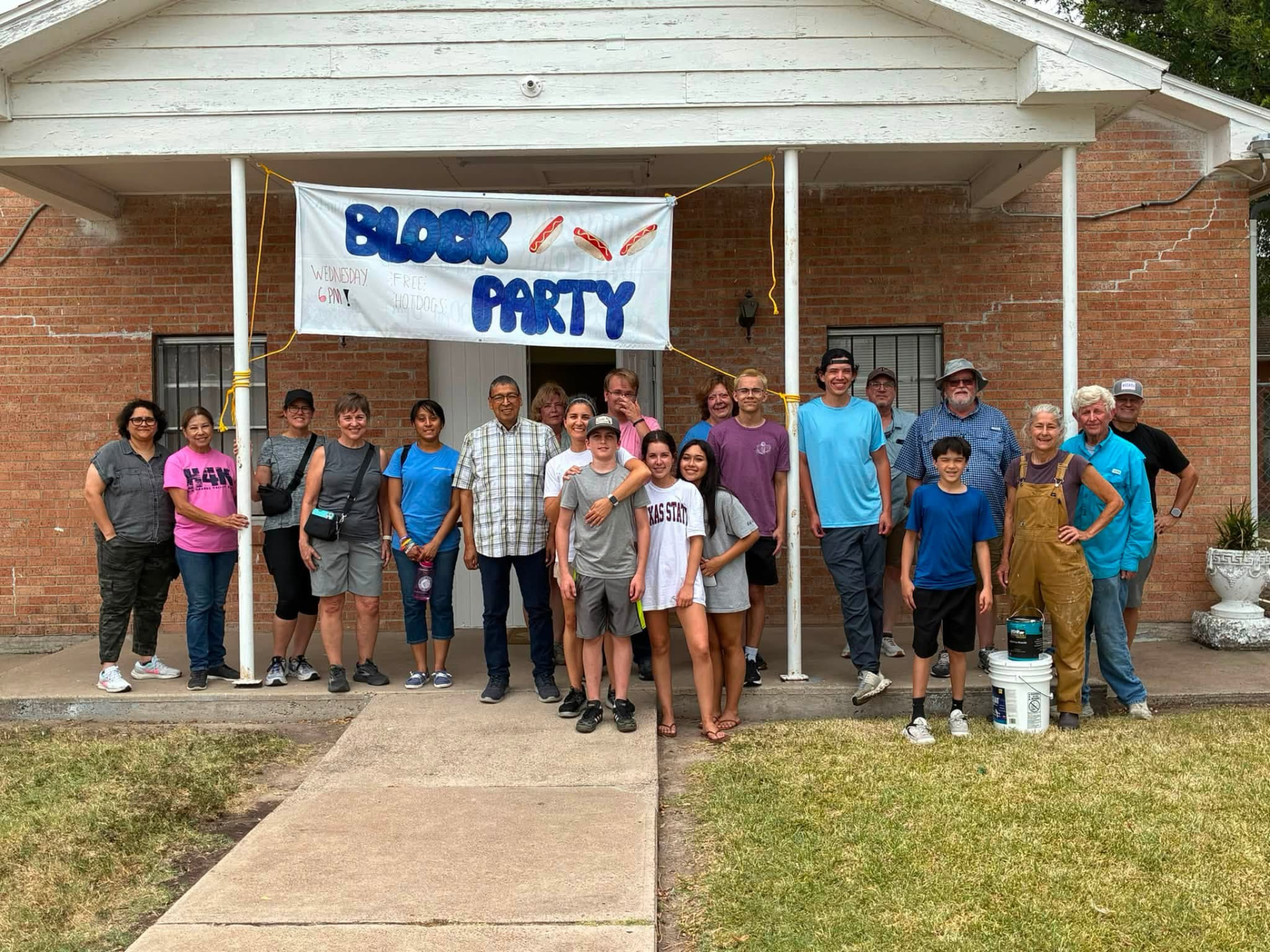 Hearts 4Kids mission team gathered outside a Rio Grande Valley home during a neighborhood service project