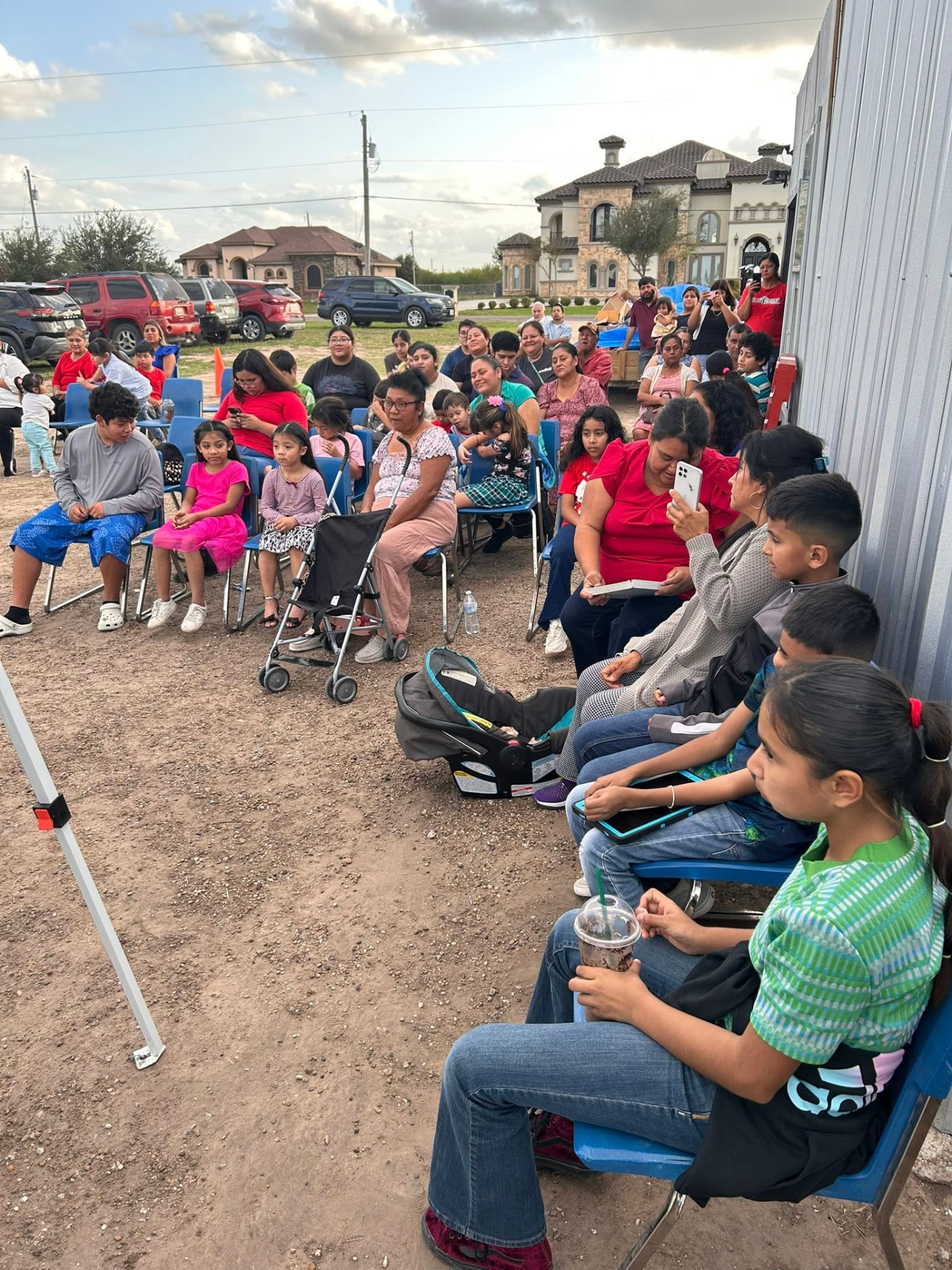 Children and families gathered outdoors for a Hearts 4Kids community program in the Rio Grande Valley