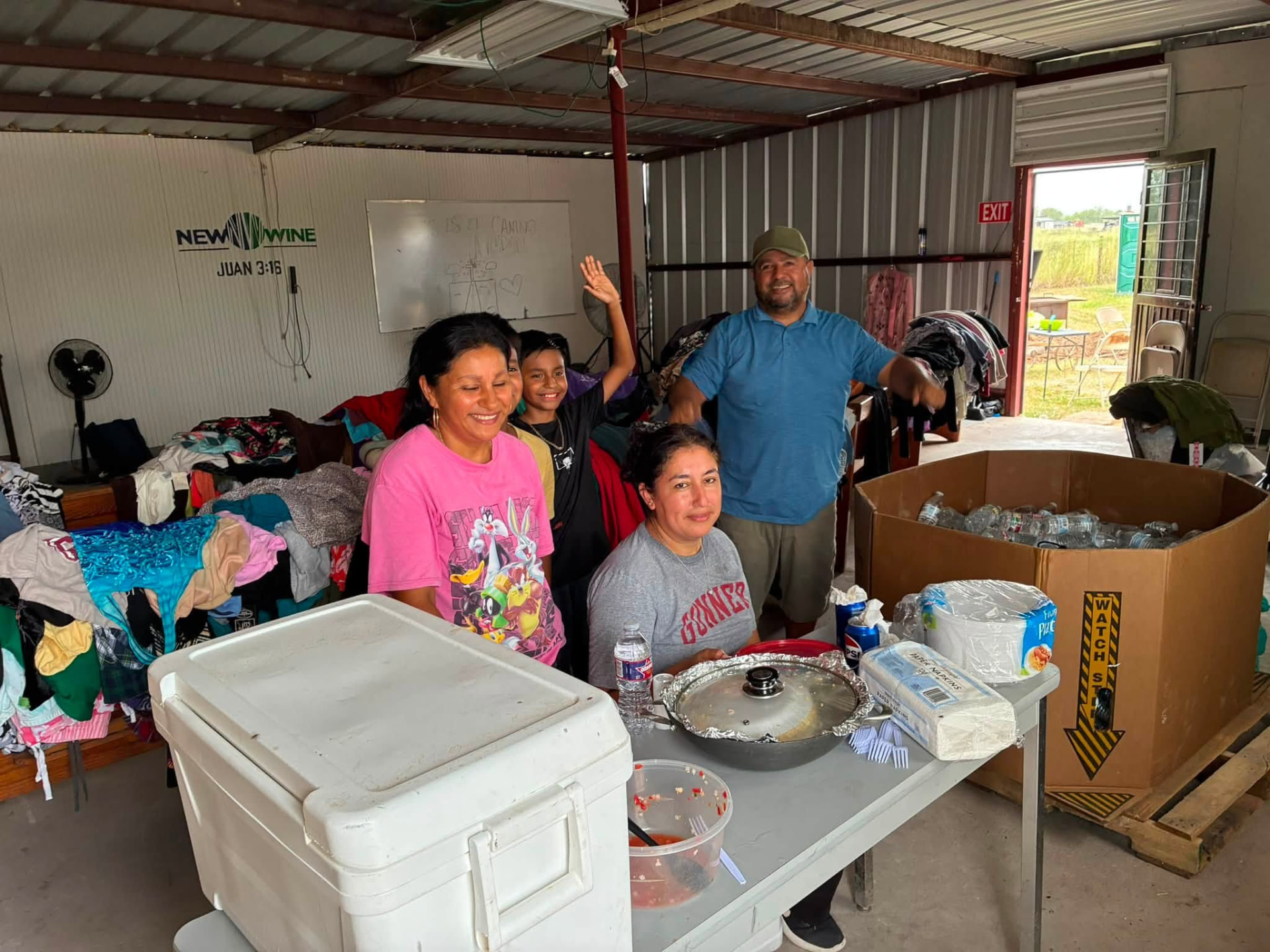 Local Hearts 4Kids volunteers serving together inside a Rio Grande Valley community center